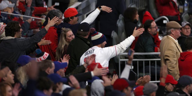 Braves fans do the tomahawk chop during a Houston Astros game at Truist Park in Atlanta, Georgia, on Oct. 29, 2021.