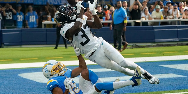 Trevor Lawrence thrives in Chargers rout of Jaguars 3 Jacksonville Jaguars cornerback Tre Herndon (37) breaks up a pass intended for Los Angeles Chargers wide receiver Jalen Guyton (15) during the second half of an NFL football game in Inglewood, Calif. , on Sunday, September 25, 2022.