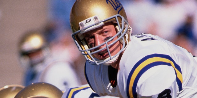 Troy Aikman, #8, quarterback for UCLA Bruins, calls the play during a college football game against Cal in October 1988 at the California Memorial Stadium.
