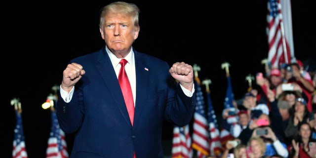 Former President Donald Trump gestures as he holds a rally Friday, Sept. 23, 2022, in Wilmington, N.C.