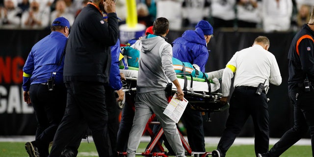 Miami Dolphins quarterback Tua Tagovailoa, #1, is carted off the field during the first half in the game against the Miami Dolphins and the Cincinnati Bengals on Sept. 29, 2022, at Paycor Stadium in Cincinnati.