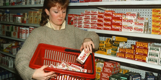 Drugstore clerk removes Tylenol capsules from the shelves of a pharmacy September 30, 1982, in New York City after reports of tampering. Seven people died in Chicago after taking Tylenol.