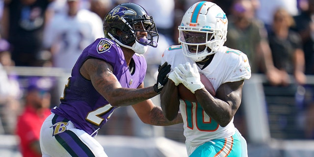 Miami Dolphins wide receiver Tyreek Hill (10) catches a pass for a touchdown against the Baltimore Ravens on Sept. 18, 2022, in Baltimore.