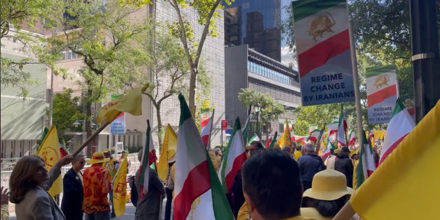 People gather at Dag Hammarskjold Park across from the UN headquarters to protest Iranian President Ebrahim Raisi's speech at the UN General Assembly on Wednesday. 