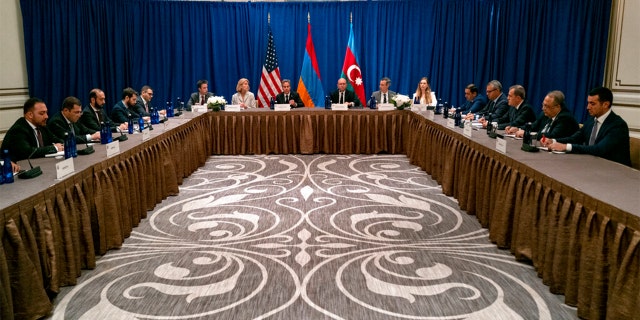 Secretary of State Antony Blinken, center, meets with an Armenian delegation including Foreign Minister Ararat Mirzoyan, third from left, and a delegation with Azerbaijan including Azerbaijani Foreign Minister Jeyhun Bayramov, third from right, Monday, Sept. 19, 2022, in New York.