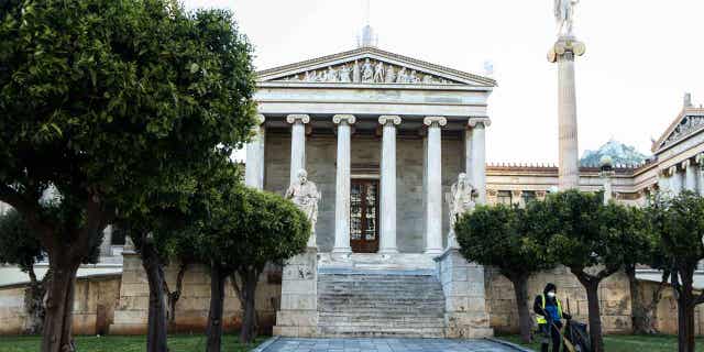 A raid on the National Technical University of Athens led to the arrests of 32 people who are suspected to be in gangs. Pictured: The central building of University of Athens in Greece on March 17, 2020.
