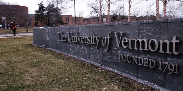 FILE - A bicyclist is seen on the campus of the University of Vermont in Burlington, Vt., Wednesday, March 11, 2020. The U.S. Department of Education is investigating allegations of antisemitism at the University of Vermont, including that some Jewish students were excluded from campus clubs and a teaching assistant threatened to reduce the grades of students who support the state of Israel. 