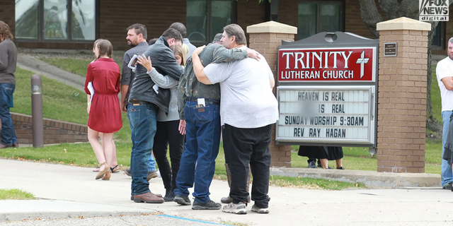 Family and friends of Cayler Ellingson attend his funeral at The Trinity Lutheran Church in Carrington, North Dakota on Monday, Sept. 26, 2022. Over a hundred people packed the small church to pay their respects after Ellingson was allegedly mowed down by an SUV during the early morning hours of Sept. 18, 2022, following a street dance at a local bar in McHenry, North Dakota.