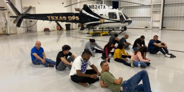 A DPS pilot was hit by an SUV as migrants were trying to flee the area.
