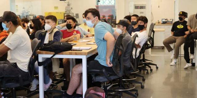 San Diego State University engineering students wearing masks inside a classroom.
