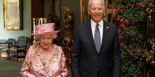 Queen Elizabeth II with US President Joe Biden in the Grand Corridor during their visit to Windsor Castle on June 13, 2021, in Windsor, England. Queen Elizabeth II hosts US President, Joe Biden and First Lady Dr Jill Biden at Windsor Castle.