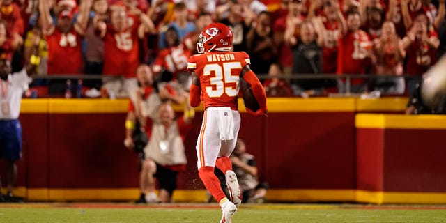Kansas City Chiefs cornerback Jaylen Watson runs an interception back for a touchdown during the second half of an NFL football game against the Los Angeles Chargers Thursday, Sept. 15, 2022, in Kansas City, Mo.