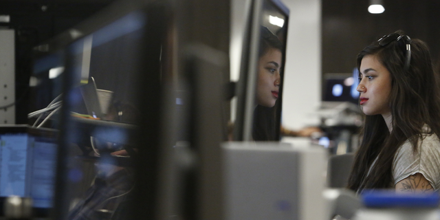 Isis Anchalee, Uber software engineer, works at her desk at Uber on Tuesday, August 23, 2016 in San Francisco, California.