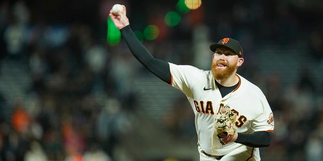 Jack Littel of the San Francisco Giants pitches against the Atlanta Braves during the eighth inning of a baseball game on Monday, September 12, 2022 in San Francisco.