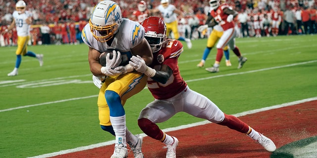 Los Angeles Chargers fullback Zander Horvath, left, scores as Kansas City Chiefs safety Justin Reid defends during the first half Sept. 15, 2022, in Kansas City, Mo.