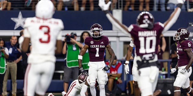 Texas A&M wide receiver Evan Stewart (1) celebrates a touchdown during the first half of the team's NCAA college football game against Arkansas in Arlington, Texas, Saturday, Sept. 24, 2022.