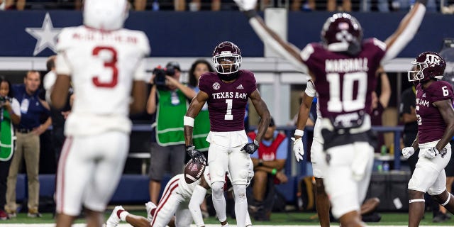 Texas A&M wide receiver Evan Stewart (1) celebrates a touchdown during the first half of the team's NCAA college football game against Arkansas in Arlington, Texas, Saturday, Sept. 24, 2022.