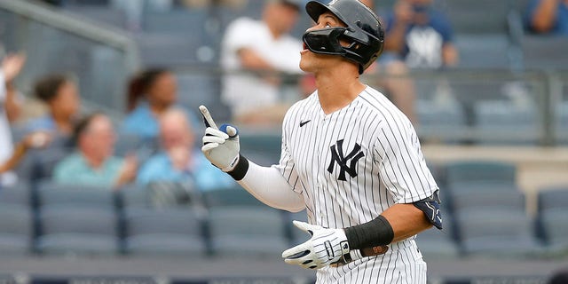 Aaron Judge of the New York Yankees gestures as he runs the bases after his fourth inning home run against the Minnesota Twins in Game 1 of a doubleheader at Yankee Stadium on September 7, 2022 in the borough of Bronx in New York.