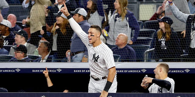 Aaron Judge, #99 of the New York Yankees, celebrates teammate Giancarlo Stanton's two run home run in the sixth inning against the Boston Red Sox at Yankee Stadium on Sept. 22, 2022 in the Bronx borough of New York City.