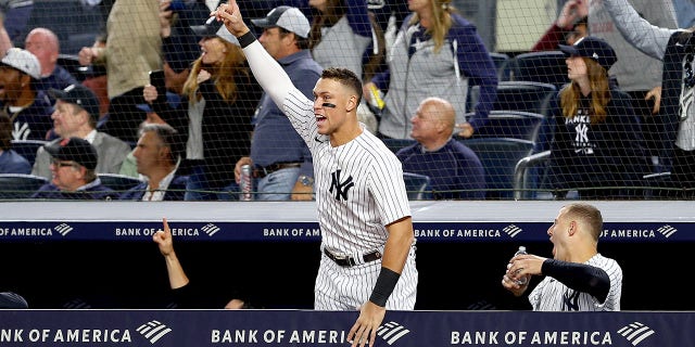 Aaron Judge, #99 of the New York Yankees, celebrates teammate Giancarlo Stanton's two run home run in the sixth inning against the Boston Red Sox at Yankee Stadium on Sept. 22, 2022 in the Bronx borough of New York City.