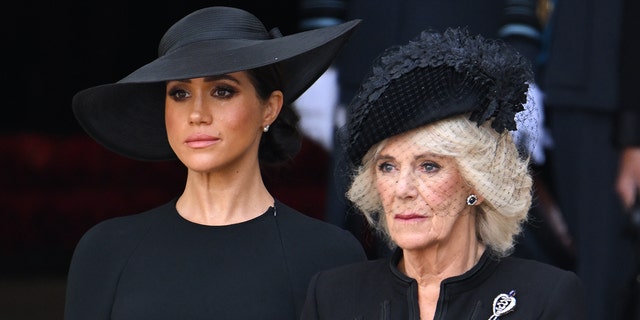Meghan, Duchess of Sussex and Camilla, Queen Consort during the State Funeral of Queen Elizabeth II at Westminster Abbey on September 19, 2022 in London, England.
