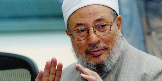 Pictuerd: Sheikh Youssef al-Qaradawi attends a conference in London on July 12, 2004.