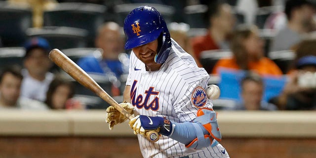 Pete Alonso of the New York Mets is hit by a pitch during the eighth inning with the bases loaded at Citi Field Sept. 15, 2022, in New York City.