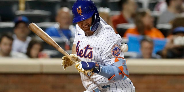 Pete Alonso of the New York Mets is hit by a pitch during the eighth inning with the bases loaded at Citi Field Sept. 15, 2022, in New York City.