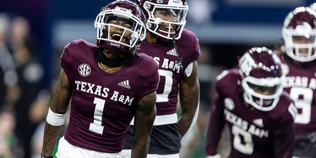 Texas A&M wide receiver Evan Stewart (1) celebrates his touchdown during the first half of the team's NCAA college football game against Arkansas on Saturday, September 24, 2022 in Arlington, Texas.