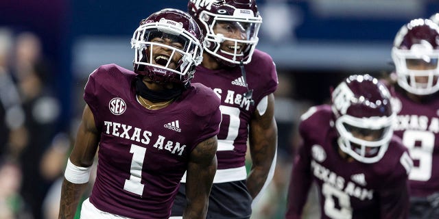 Texas A&M wide receiver Evan Stewart (1) celebrates his touchdown during the first half of the team's NCAA college football game against Arkansas on Saturday, September 24, 2022 in Arlington, Texas.