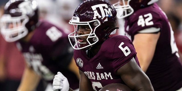 Texas A&amp;M running back Devon Achane (6) carries the ball during the first half of the team's NCAA college football game against Arkansas on Saturday, Sept. 24, 2022, in Arlington, Texas.