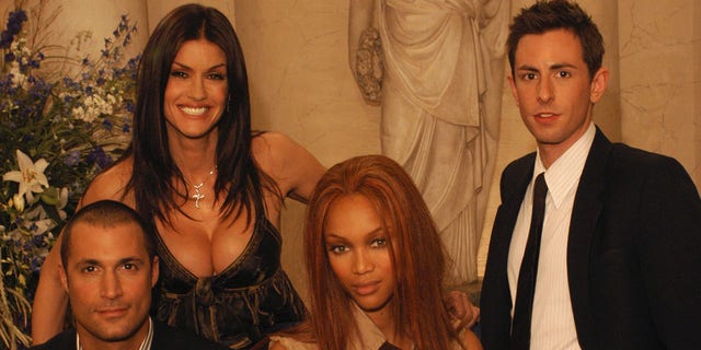 Promotional portrait of the judges on the UPN television series 'America's Next Top Model,' Milan, Italy, October 17, 2003. Left to right British fashion photographer Nigel Barker, model Janice Dickinson, American model and the show's executive producer Tyra Banks, and fashion editor Eric Nicholson. 