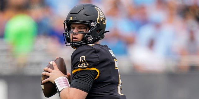 Appalachian State Mountaineers quarterback Chase Brice (7) drops back to pass during the second half at Kidd Brewer Stadium.