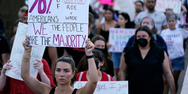 Protesters march around the Arizona Capitol in Phoenix after the Supreme Court decision to overturn Roe v. Wade on June 24, 2022.