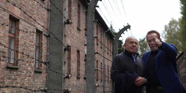 Arnold Schwarzenegger meets with Simon Bergson, chairman of The Auschwitz Jewish Center Foundation, during his trip to Auschwitz in Oswiecim, Poland, on Sept. 28, 2022.