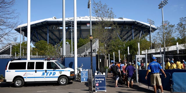 Fans gather outside of security to enter the venue on Day Two of the 2016 US Open at the USTA Billie Jean King National Tennis Center on August 30, 2016 in the Flushing neighborhood of the Queens borough of New York City.