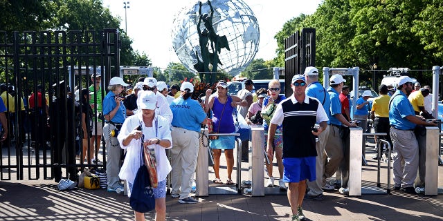 Fans gather outside of security to enter the venue on Day Two of the 2016 US Open at the USTA Billie Jean King National Tennis Center on August 30, 2016, in the Flushing neighborhood of the Queens borough of New York City.