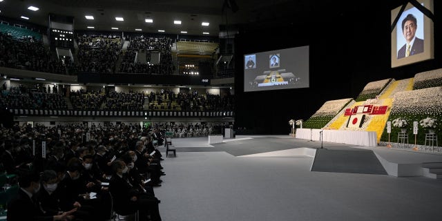 Guests wait for the state funeral of former Prime Minister Shinzo Abe to begin at the Nippon Budokan in Tokyo on Sept. 27, 2022. 