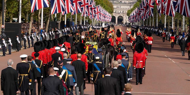 Senior members of the British Royal Family follow behind the coffin of Queen Elizabeth II during a procession from Buckingham Palace to Westminster Hall. 