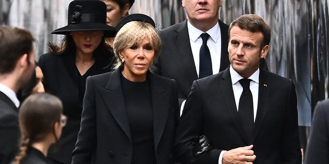 French President Emmanuel Macron and his wife Brigitte arrive at Westminster Abbey wearing all black for Queen Elizabeth's state funeral