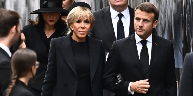 French President Emmanuel Macron and his wife Brigitte arrive at Westminster Abbey wearing all black for Queen Elizabeth's state funeral