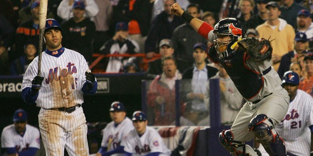 Catcher Yadier Molina of the St. Louis Cardinals reacts after Carlos Beltran (15) of the New York Mets strikes out to end Game 7 of the NLCS at Shea Stadium Oct. 19, 2006, in the Flushing neighborhood of the Queens borough of New York City. The Cardinals won 3-1.