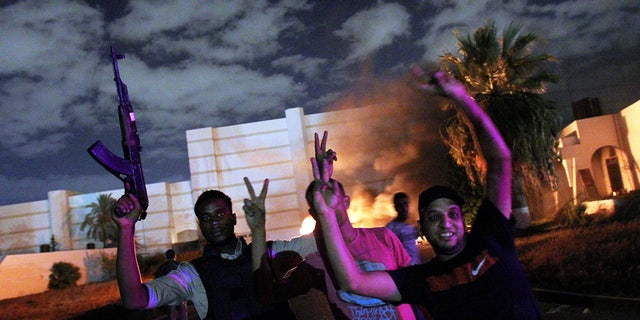 Protesters forced members of the hardline Islamist group Ansar el-Sharia out of their base on Sept. 21, 2012, in Benghazi, Libya. The mob set at least one vehicle on fire at the compound.