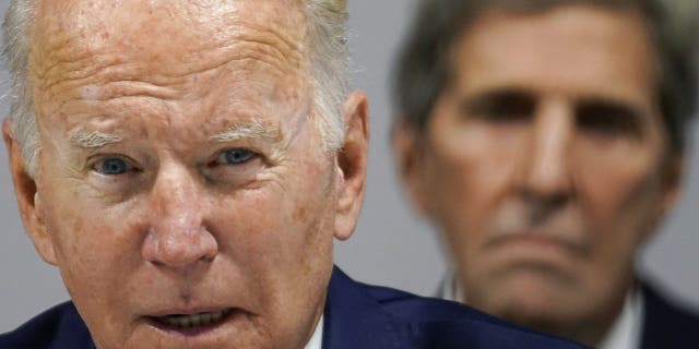 President Biden and Climate Envoy John Kerry are pictured during the 2021 United Nations climate summit in Scotland.