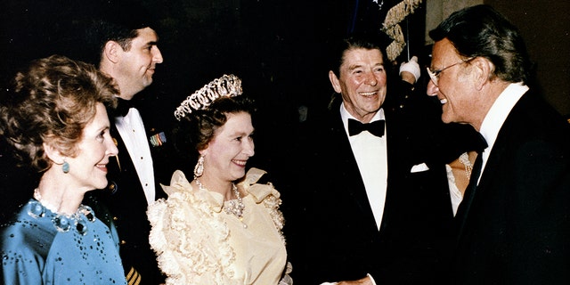 Queen Elizabeth II of Britian pictured with U.S. president Ronald Reagan and the Rev. Billy Graham