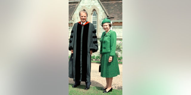 Queen Elizabeth II is pictured with the Rev. Billy Graham in this image.
