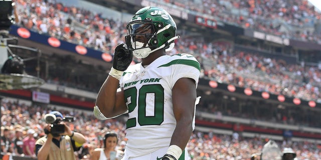 Breece Hall of the New York Jets reacts after catching a touchdown pass against the Cleveland Browns at FirstEnergy Stadium Sept. 18, 2022, in Cleveland.