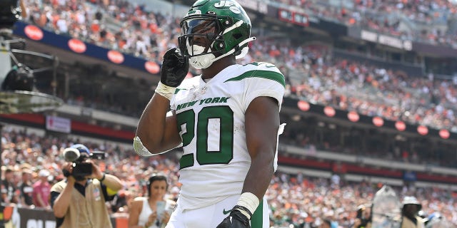 Breece Hall of the New York Jets reacts after catching a touchdown pass against the Cleveland Browns at FirstEnergy Stadium Sept. 18, 2022, in Cleveland.