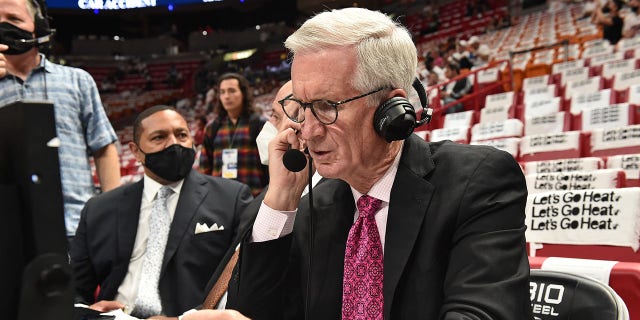 ESPN's Mike Breen speaks over his headset before a game between the Boston Celtics and the Miami Heat during Game 1 of the 2022 NBA Eastern Conference finals May 17, 2022, at FTX Arena in Miami, Fla.