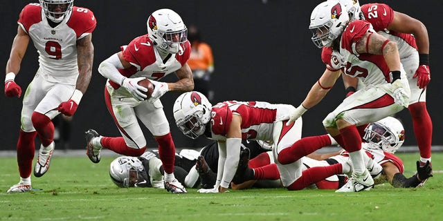 Arizona Cardinals cornerback Byron Murphy Jr. (7) lands a fumble and returns it for the game-winning touchdown in overtime against the Las Vegas Raiders in Las Vegas on September 18, 2022.